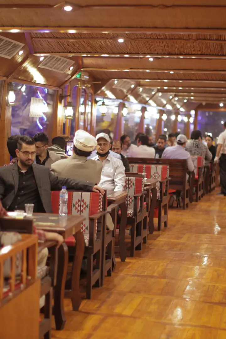 Guests are in Dining Area while sailing in Al Seef Dhow Cruise