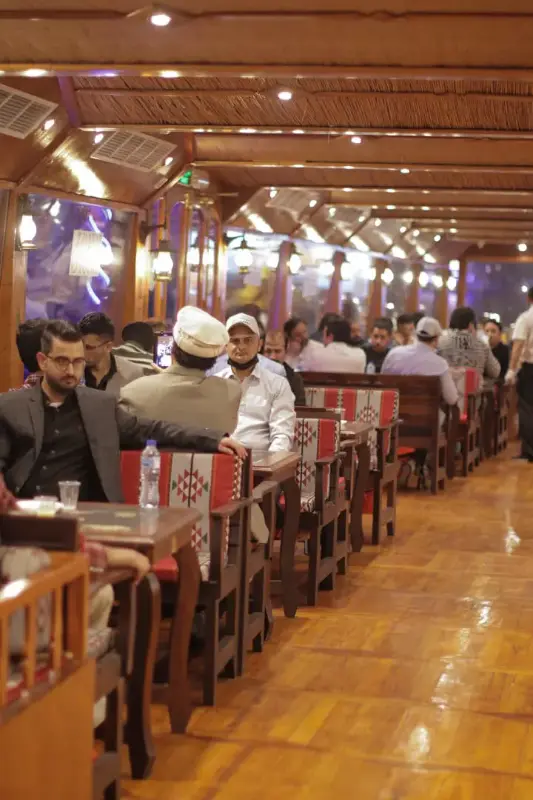 Guests are in Dining Area while sailing in Al Seef Dhow Cruise