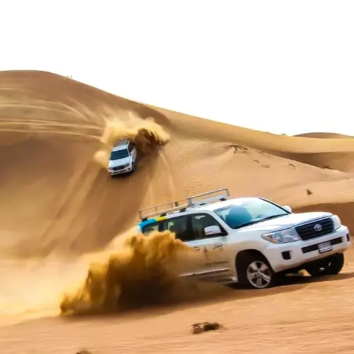 Navigating to the Classic Desert Safari Adventure: Dune Bashing & Evening Entertainment