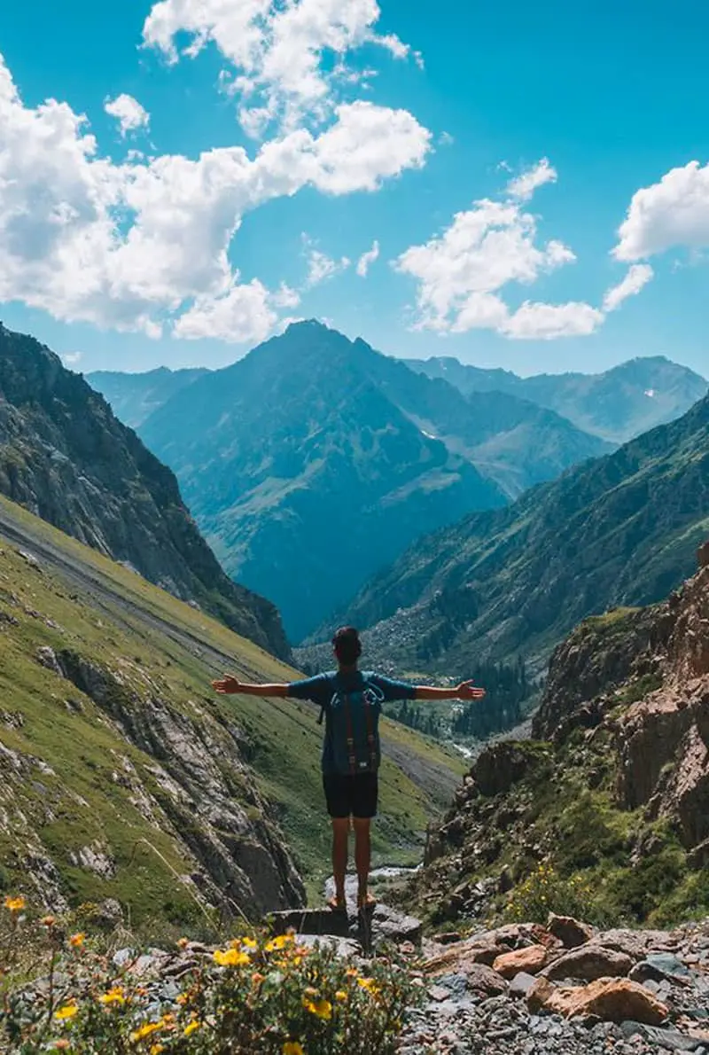 A man standing along the mountain in Kyrgystan