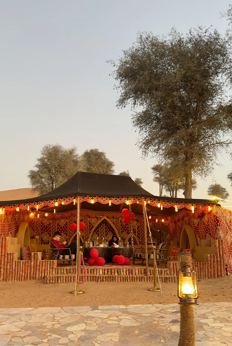 a majlis camp in the middle of the desert